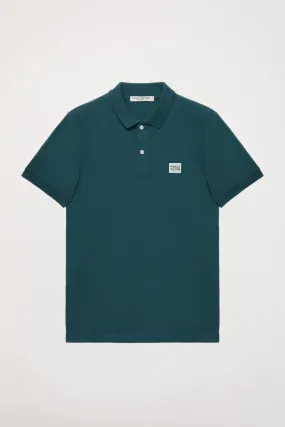 Polo orgánico de manga corta azul petróleo Neutrals con logo